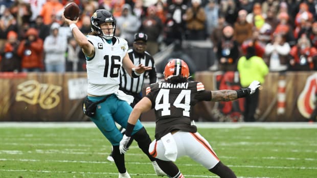 Dec 10, 2023; Cleveland, Ohio, USA; Jacksonville Jaguars quarterback Trevor Lawrence (16) throws a pass over Cleveland Browns linebacker Sione Takitaki (44) during the first half at Cleveland Browns Stadium.